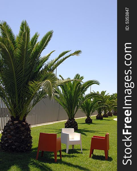 Colorful chairs in tropical park