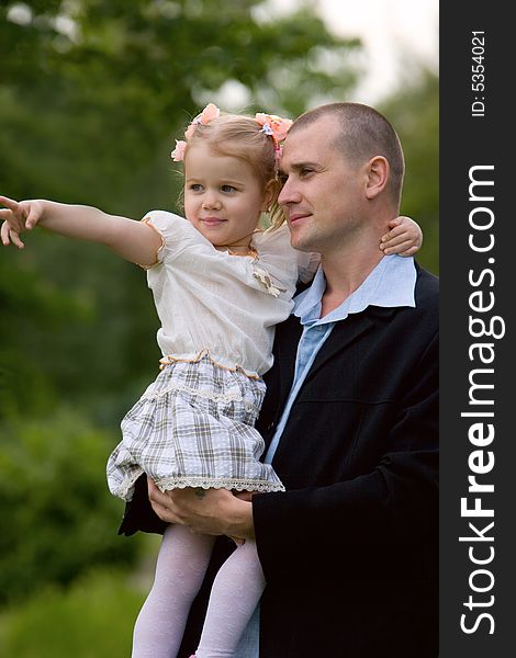 Father and little daughter outdoor portrait. Father and little daughter outdoor portrait