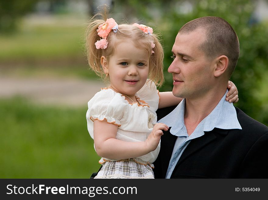 Father and little daughter outdoor portrait. Father and little daughter outdoor portrait