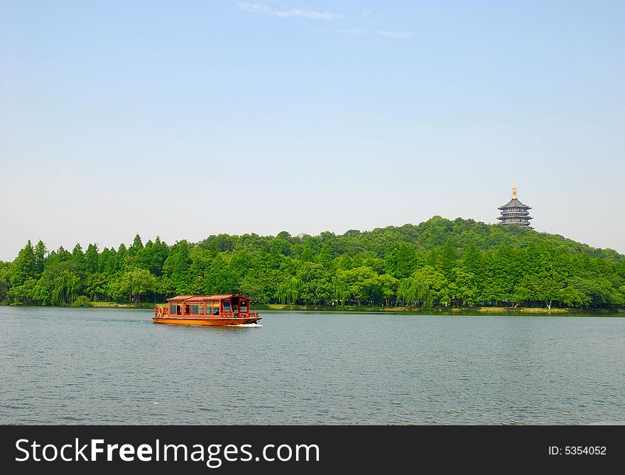 West Lake in Hangzhou China, with boat and Leifeng pagoda. West Lake in Hangzhou China, with boat and Leifeng pagoda