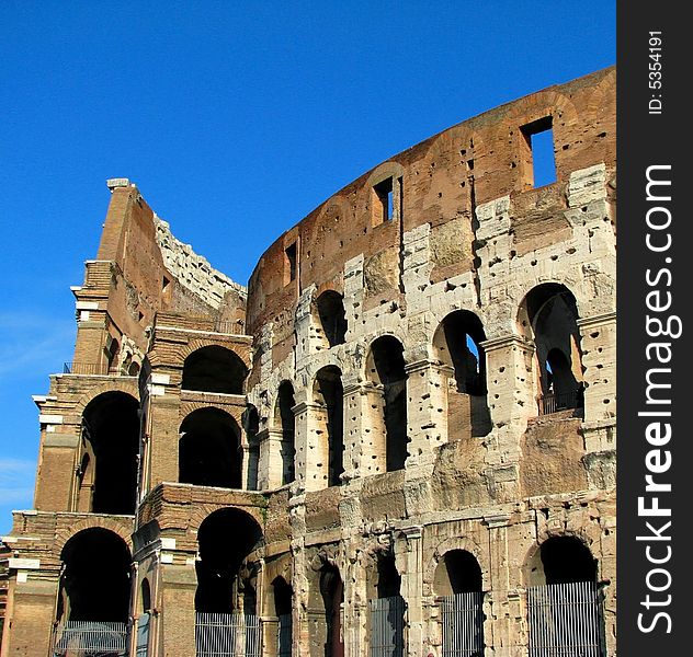 A side view of the Rome Coliseum. A side view of the Rome Coliseum.
