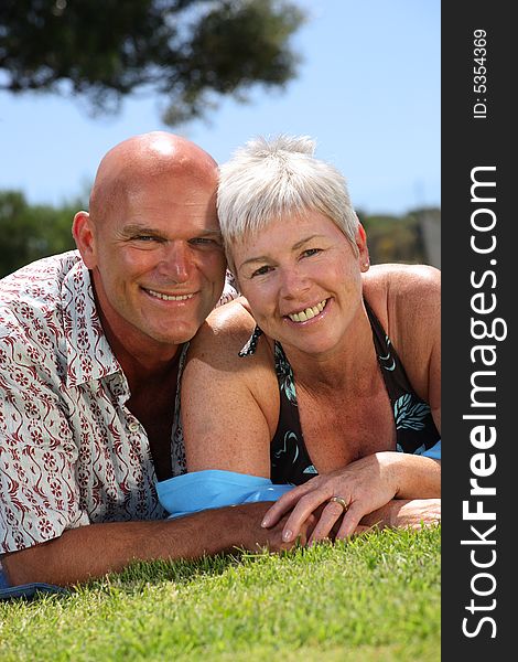 Beautiful mature couple relaxing outdoors. Beautiful mature couple relaxing outdoors