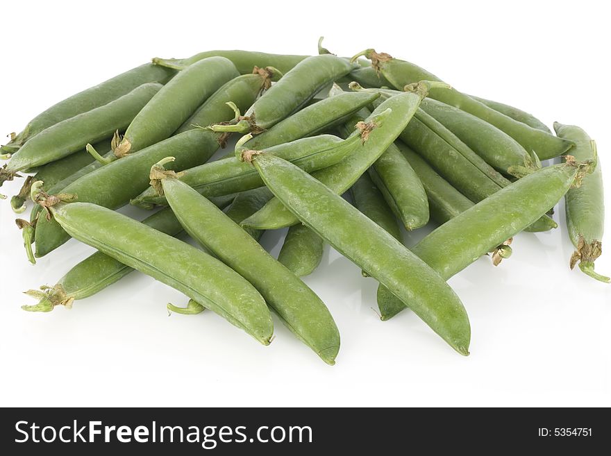 Fresh green peas isolated on a white background