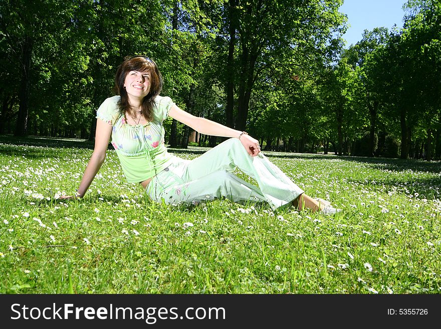 Cute happy girl relaxing outdoors. Cute happy girl relaxing outdoors