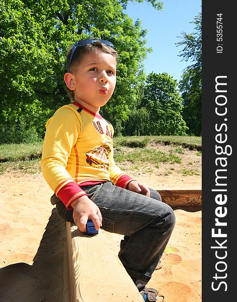 Cute little boy playing outdoors