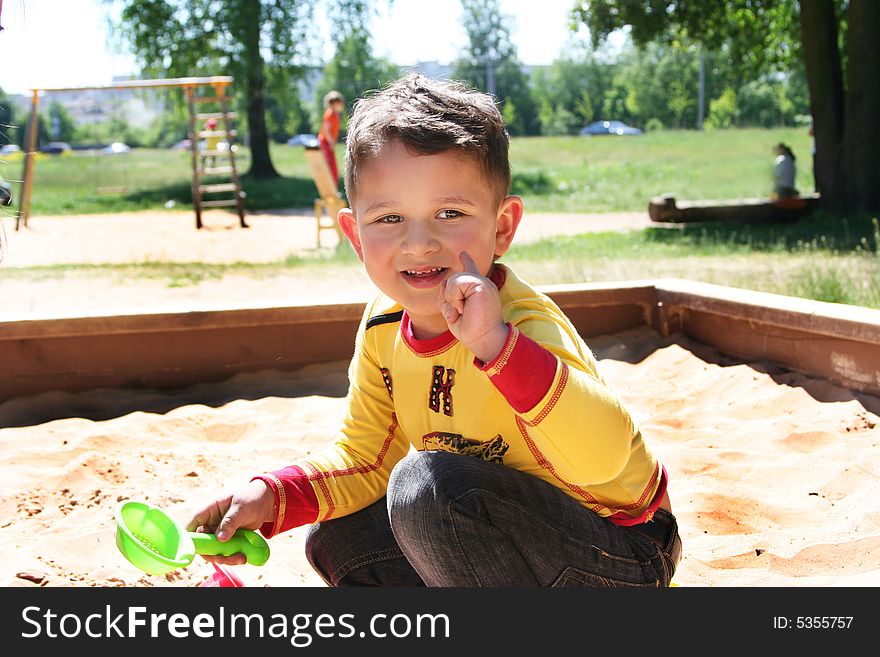Little cute kid playing outdoors