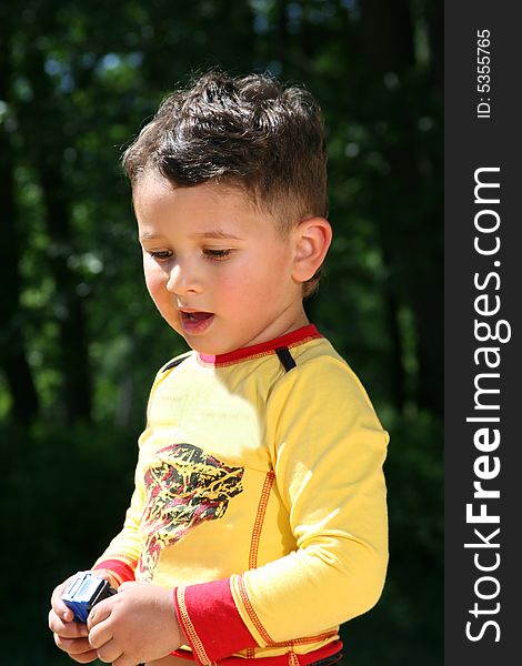 Cute little kid playing outdoors