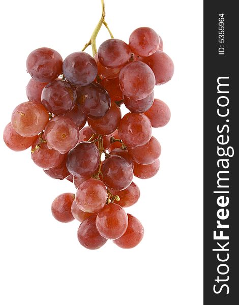 The bunch of ripe red grapes on the white background. The bunch of ripe red grapes on the white background