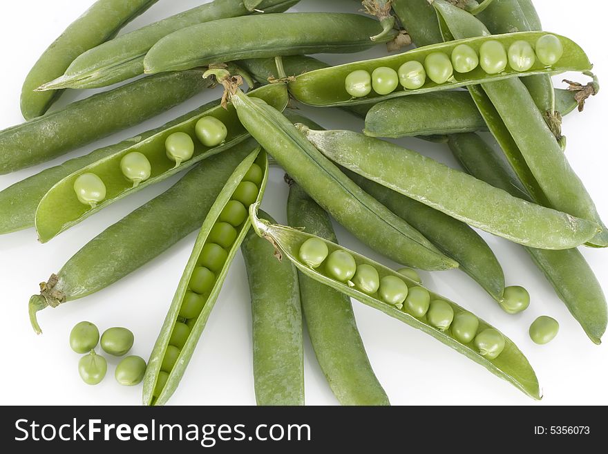 Fresh green peas isolated on a white background