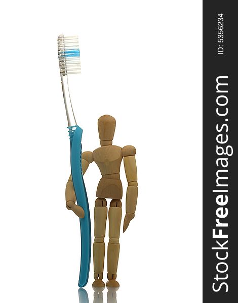 Manikin standing with blue toothbrush. Manikin standing with blue toothbrush