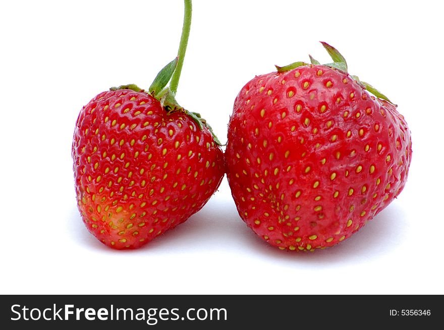 Two strawberries isolated on the white background