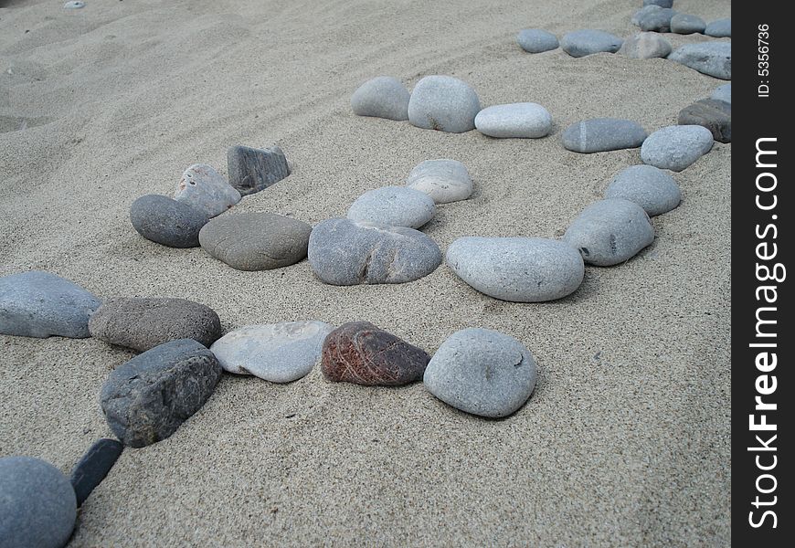 Hello written with stones on the beach. Hello written with stones on the beach