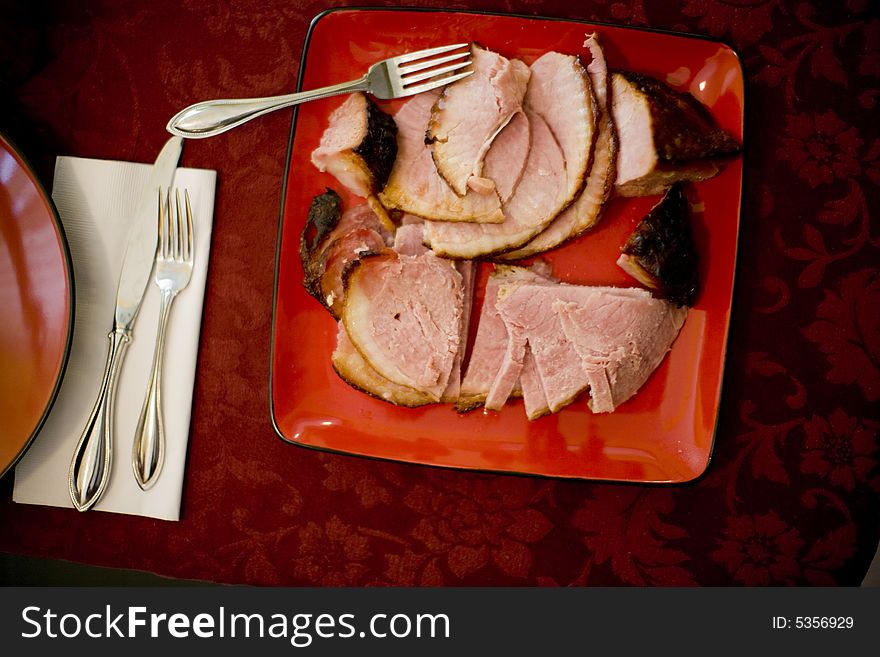 Over head view of delicious plate of ham on dinner table. Over head view of delicious plate of ham on dinner table