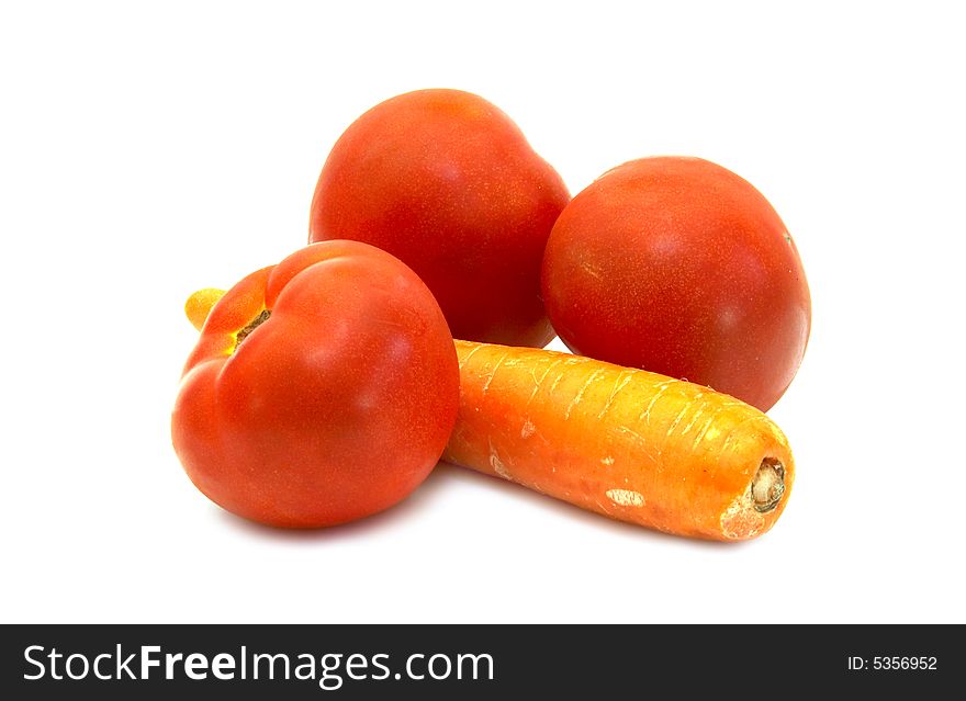 Juicy tomatoes with carrot close-up (isolated)