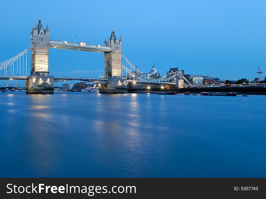 Tower Bridge located in London, England crossing over the River Thames. It is close to the Tower of London and has become an iconic symbol of London. Tower Bridge located in London, England crossing over the River Thames. It is close to the Tower of London and has become an iconic symbol of London.