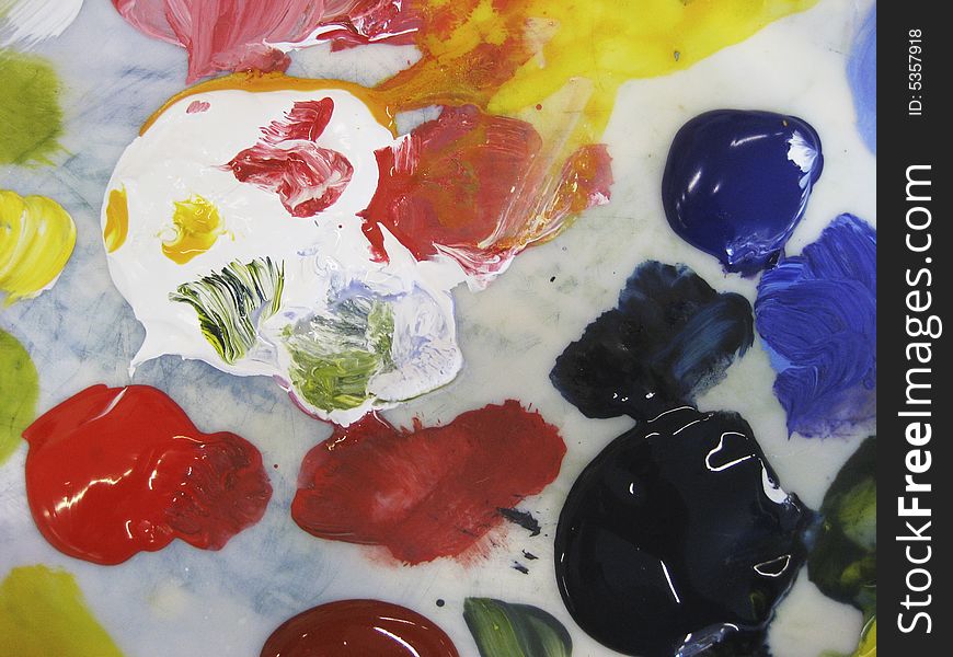 Acrylis colors on an artist palette, prepared for painting. Acrylis colors on an artist palette, prepared for painting