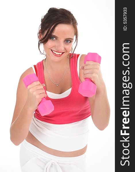 Young woman exercising with pink dumbbells isolated on white