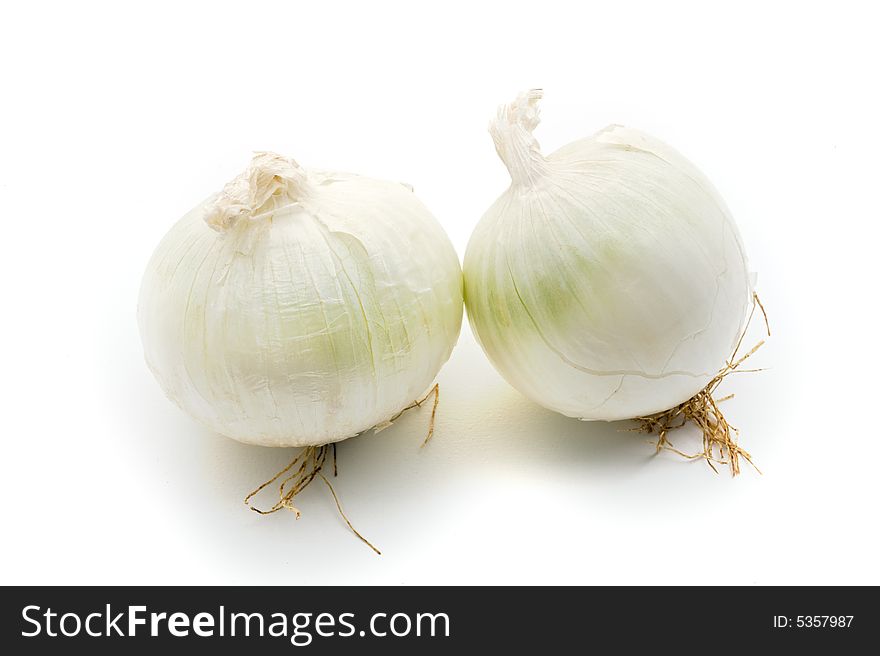 Two white onions isolated on white background