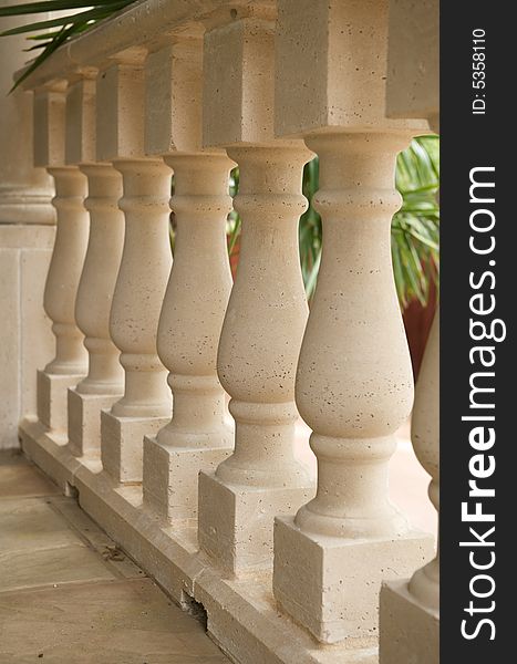 An abstract image of an upscale patio's luxurious pillar railing