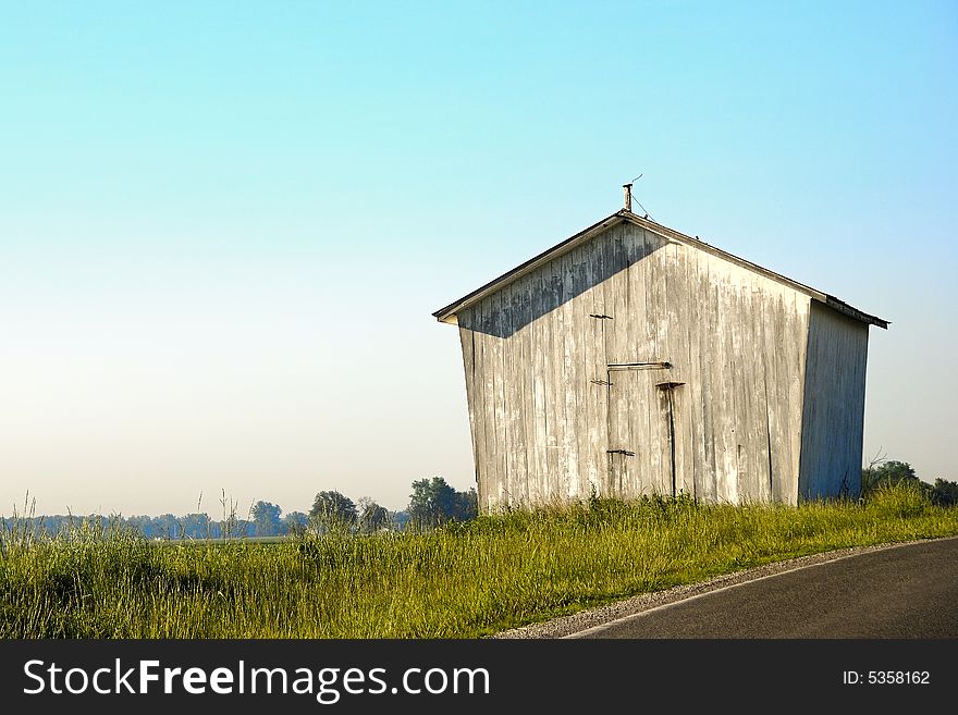 Isolated shapely barn in open spaces. Isolated shapely barn in open spaces