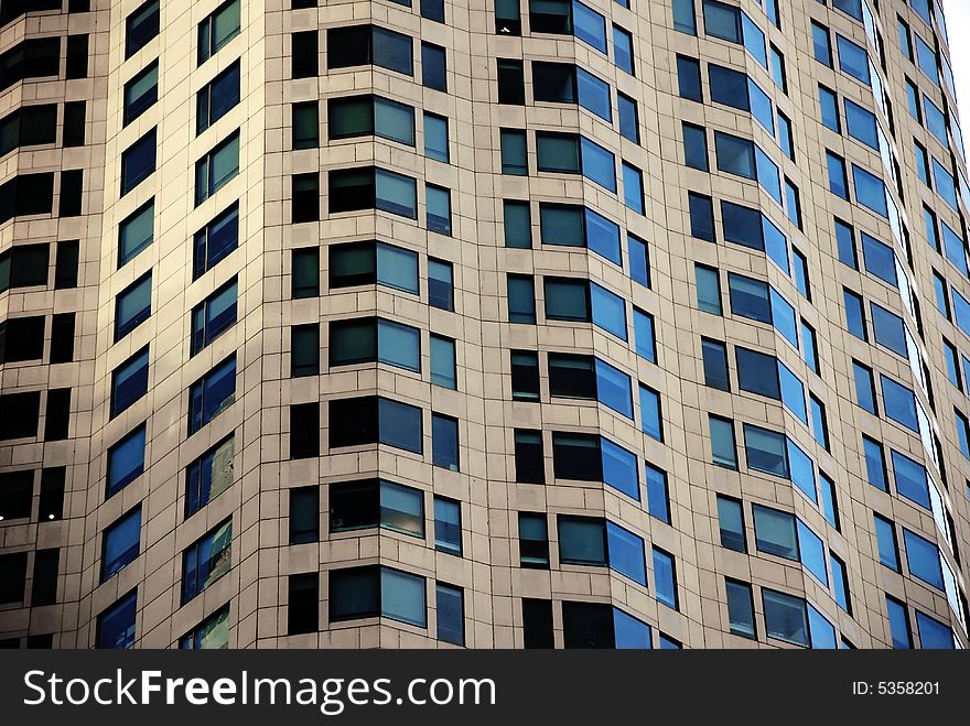 A close shot of the darkened windows of a high rise building or skyscraper in downtown Los Angeles. A close shot of the darkened windows of a high rise building or skyscraper in downtown Los Angeles