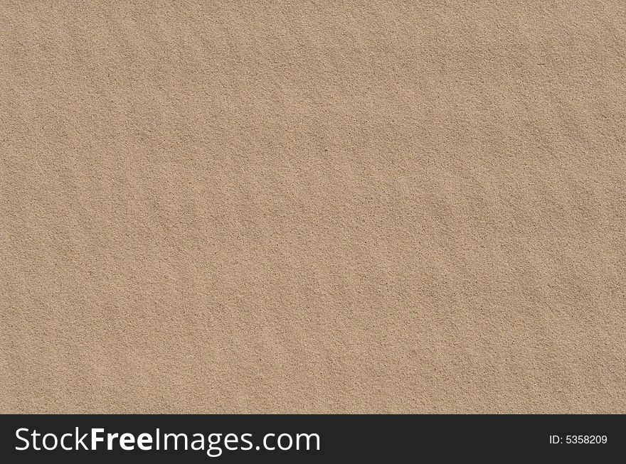 An up close image of a patterned sand dune. An up close image of a patterned sand dune