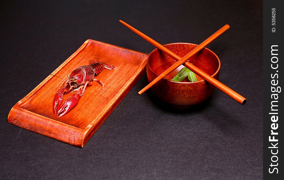 Seafood crawfish in a wooden plate. Seafood crawfish in a wooden plate.