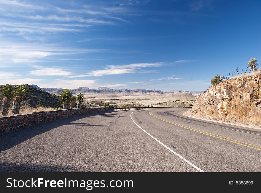 An image of an open highway in the Texas hill country