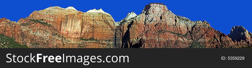 A panoramic view of the sandstone cliffs of Zion National Park, Utah.