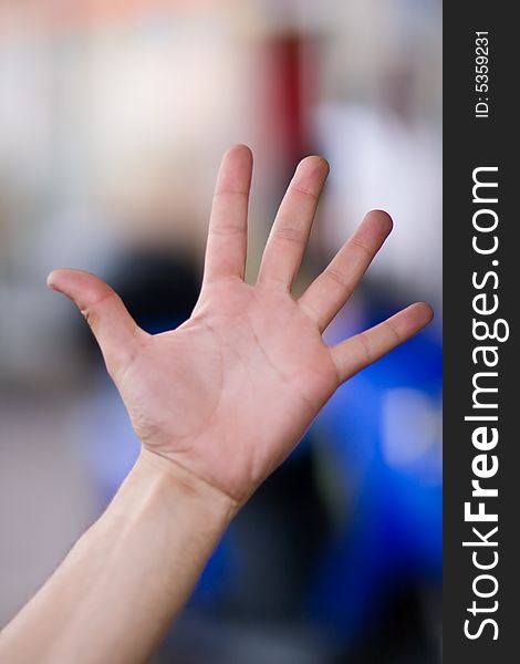 Five finger up on blury background. Five finger up on blury background