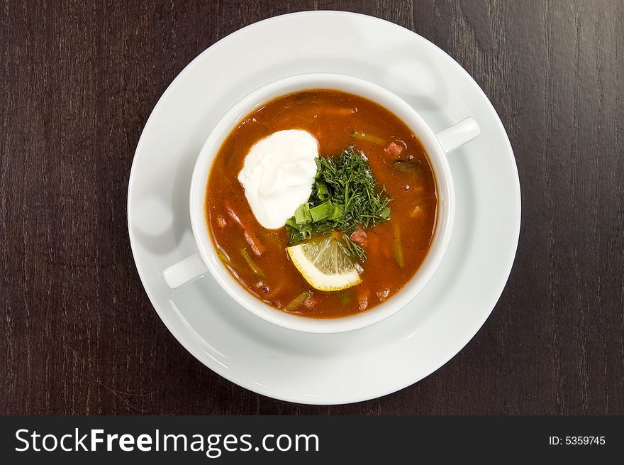 Vegetable soup on a white plate. Vegetable soup on a white plate.