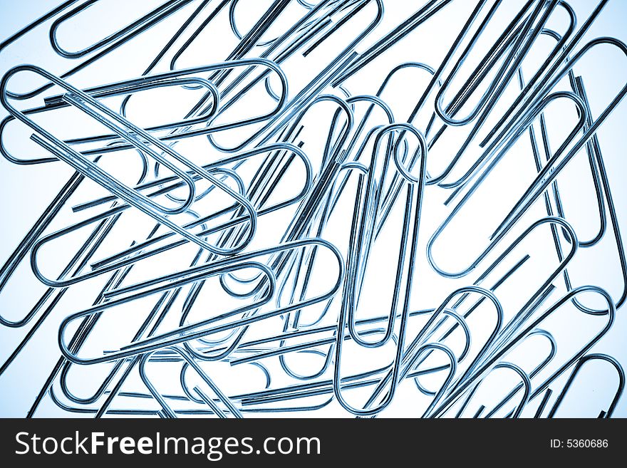 A Pile of Paper Clips on White Background