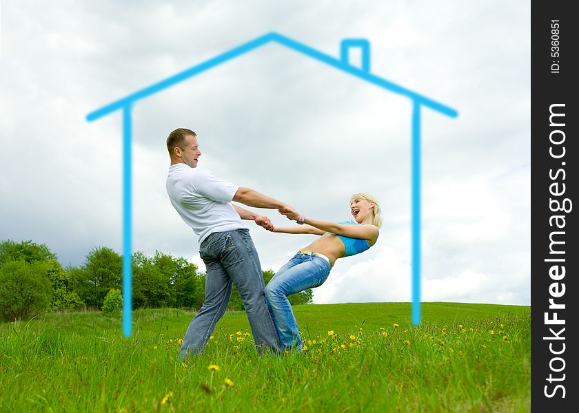 Young family jumping on a lawn