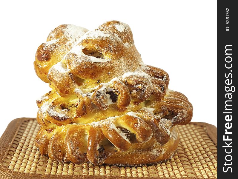 Sweet roll with raisin isolated on a white background