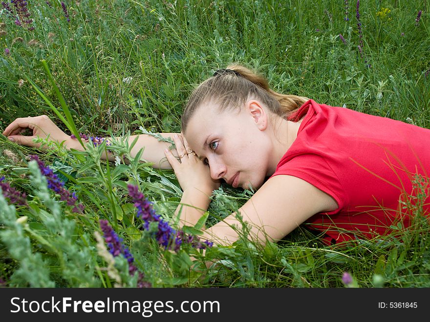 Pretty girl rest on meadow