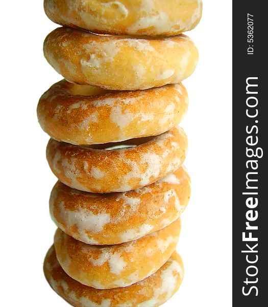 Close up. Isolated bagels by column on white background. Close up. Isolated bagels by column on white background.