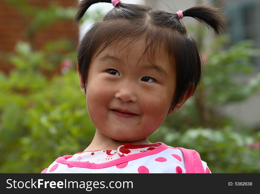Cute little Chinese girl in summer