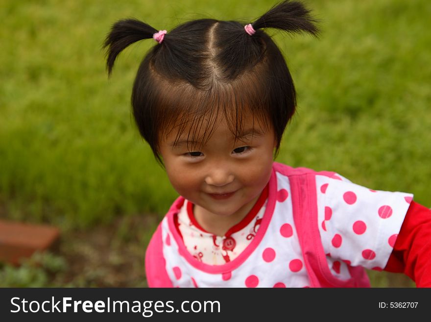 Cute little Chinese girl in summer