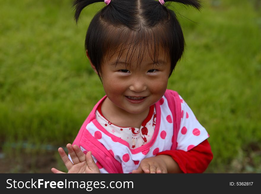 Cute little Chinese girl in summer