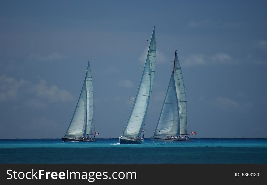 Three big yachts in an ocean competition. Three big yachts in an ocean competition