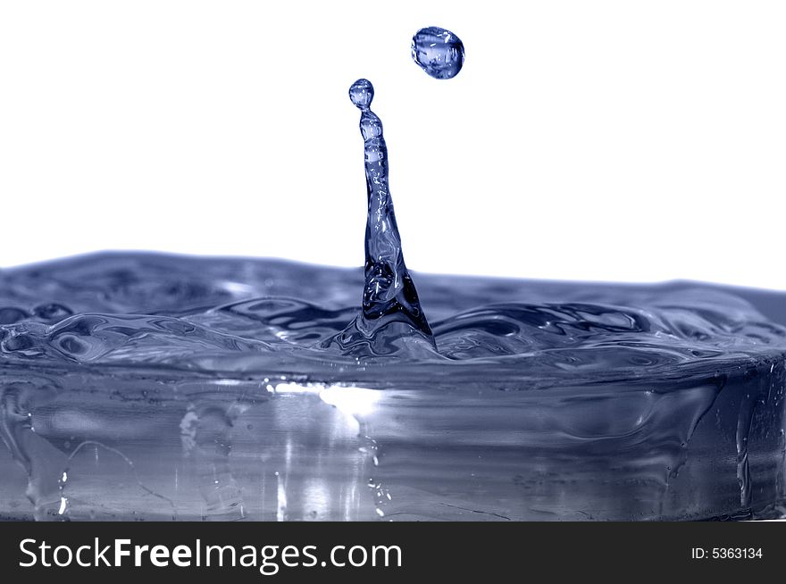 Isolated blue drops are falling down and impact with liquid surface. Isolated blue drops are falling down and impact with liquid surface