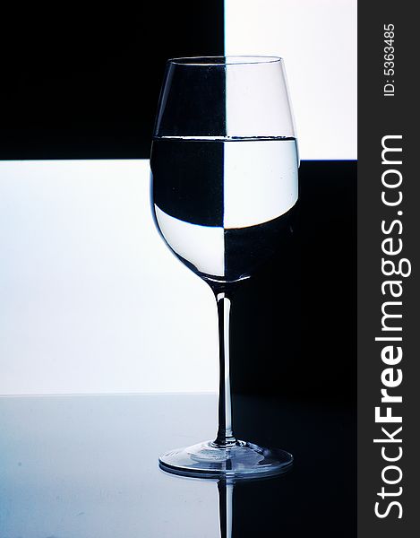 Glass with water with background