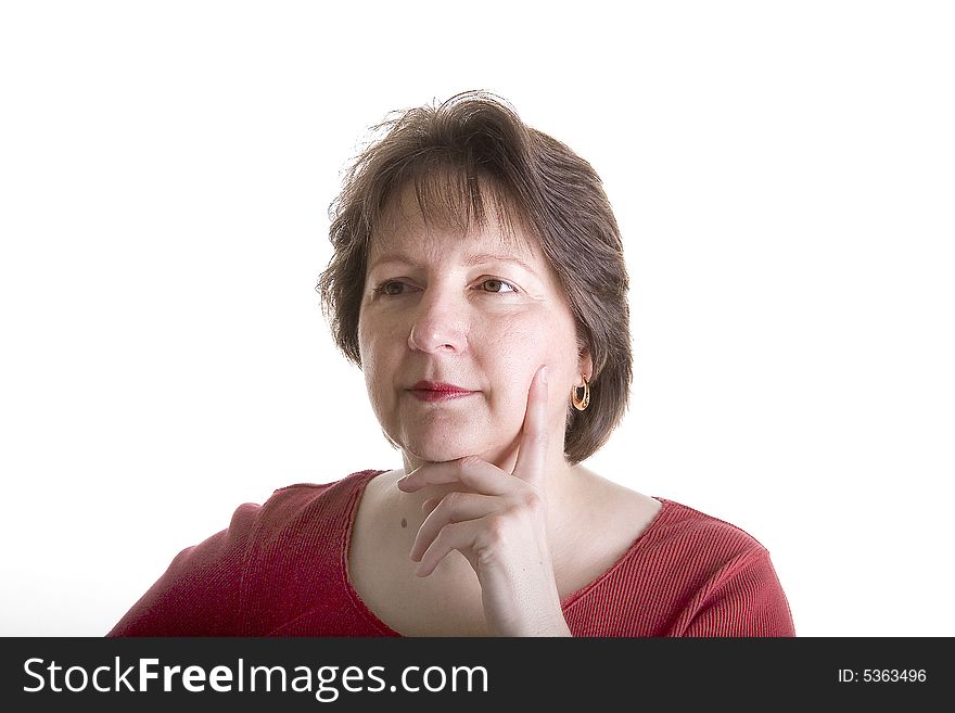 A nice looking woman in red on a white background with her hand on her cheek. A nice looking woman in red on a white background with her hand on her cheek