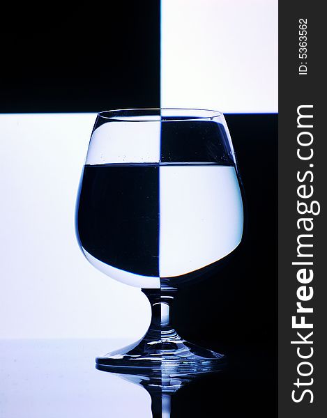 Glass with water with background