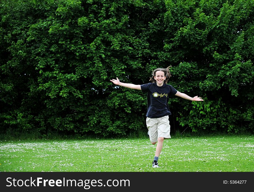 Portrait of child running outdoors. Portrait of child running outdoors