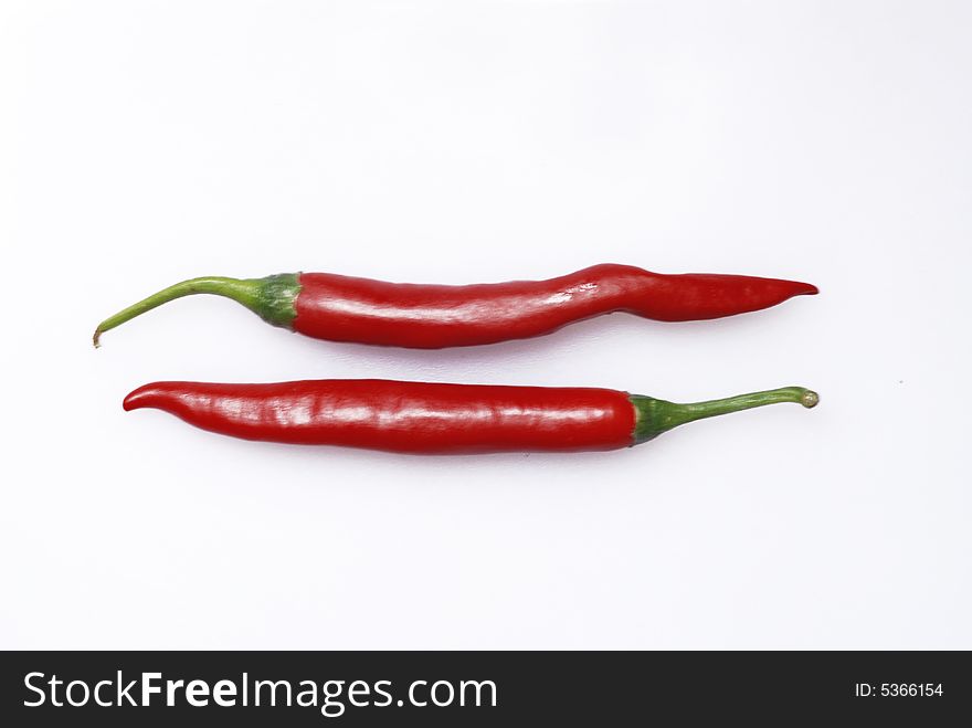 Close up of red chilli peppers on white background. Close up of red chilli peppers on white background