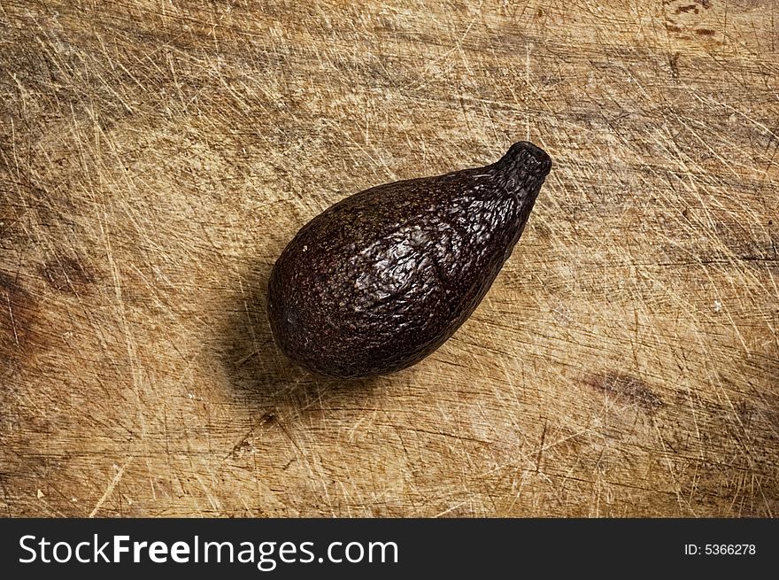 Avocado On Wooden Table.