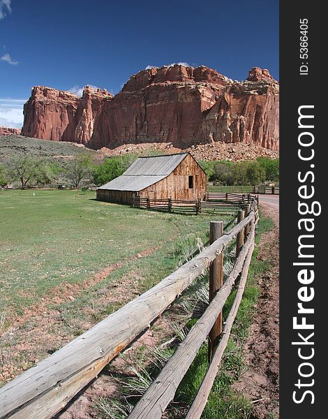 Historic farm in Capitol Reef National Park. Beautiful geologic features in background. Utah. USA