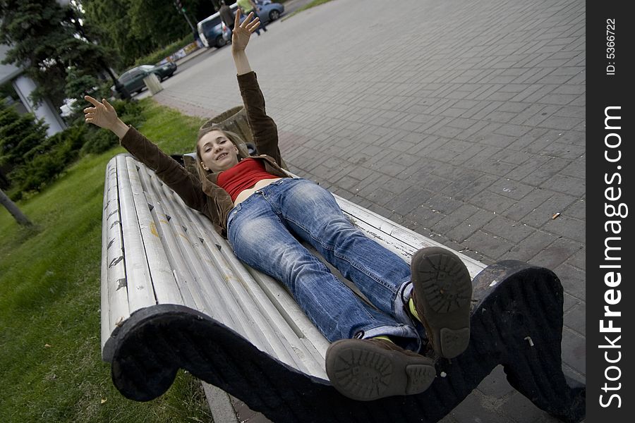 Girl lying on the bench