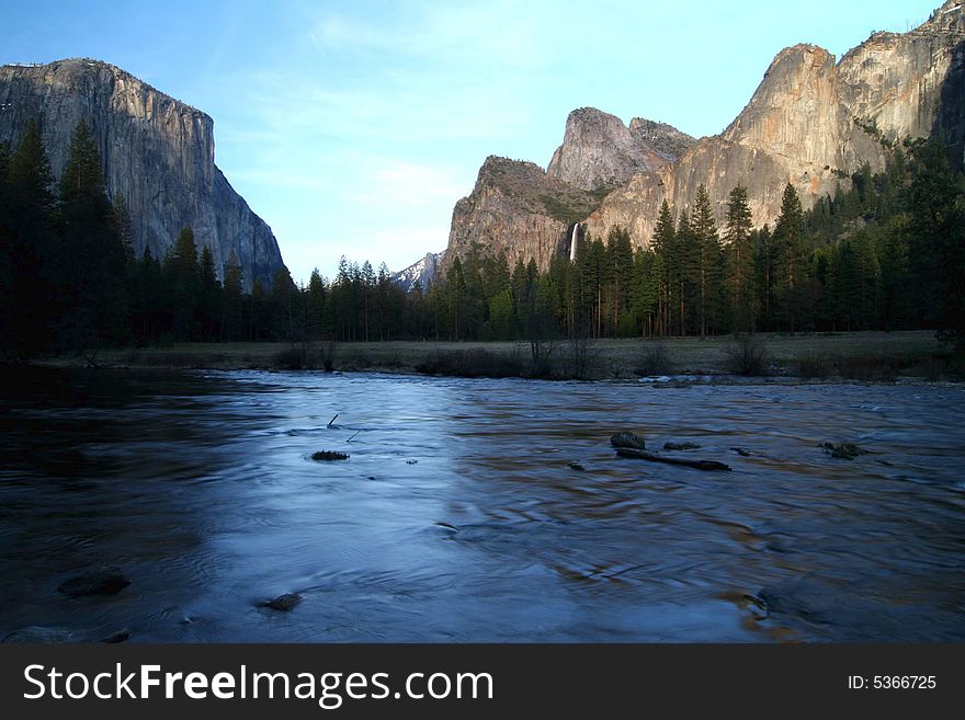 El Capitano and Bridevail fall with Riverbed at early dawn hours in Yosemite national park. California. USA